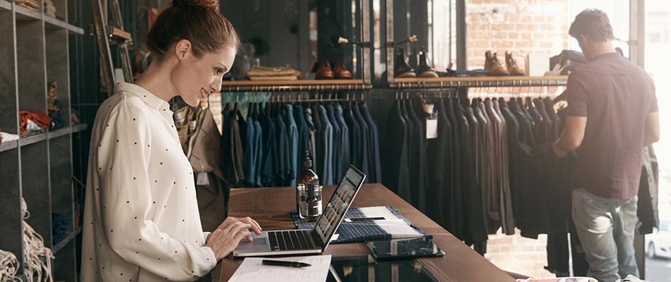 A lady working in at small retail business