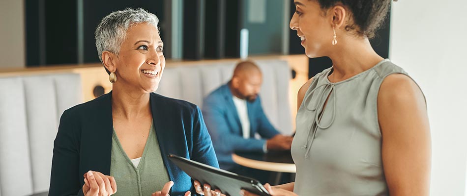 Two business ladies meeting in an office